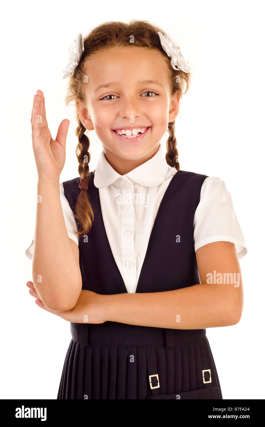 Little Schoolgirl isolato su uno sfondo bianco Foto Stock