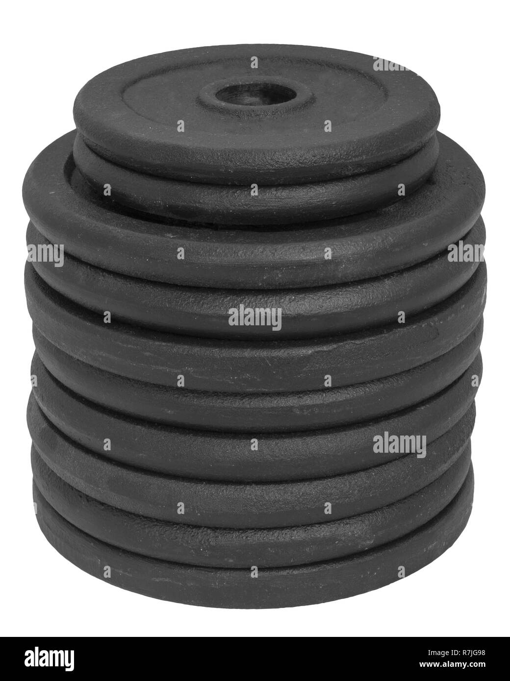 Alta pila di dischi dumbbell isolati su sfondo bianco. Foto Stock