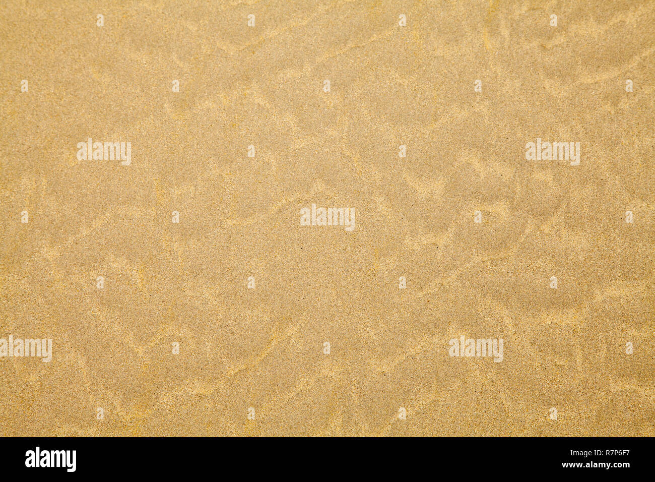 Tan spiaggia di sabbia con ripple sfondo Pattern. Foto Stock