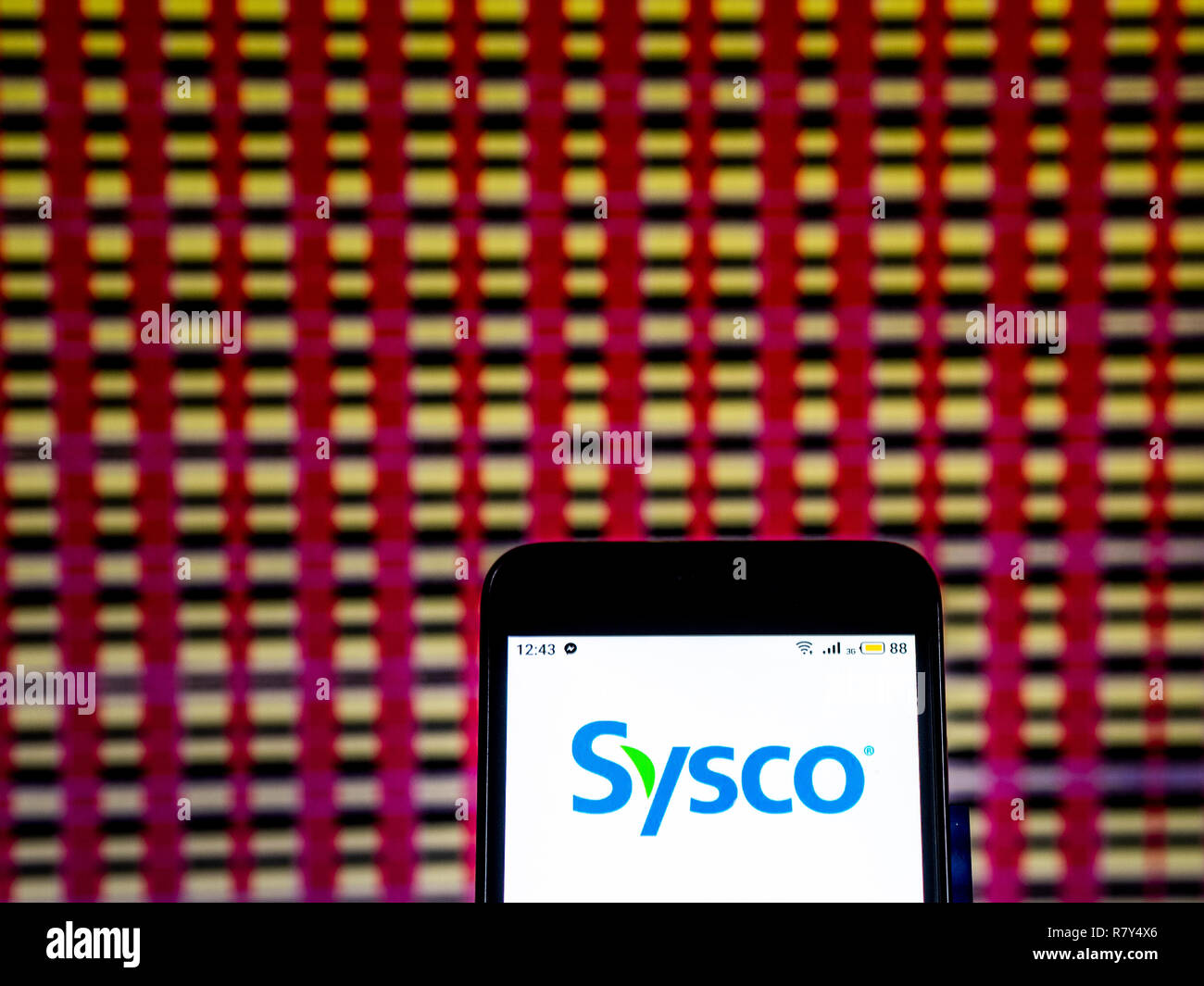 Sysco Wholesale Company logo che si vede visualizzato sul telefono intelligente. Foto Stock