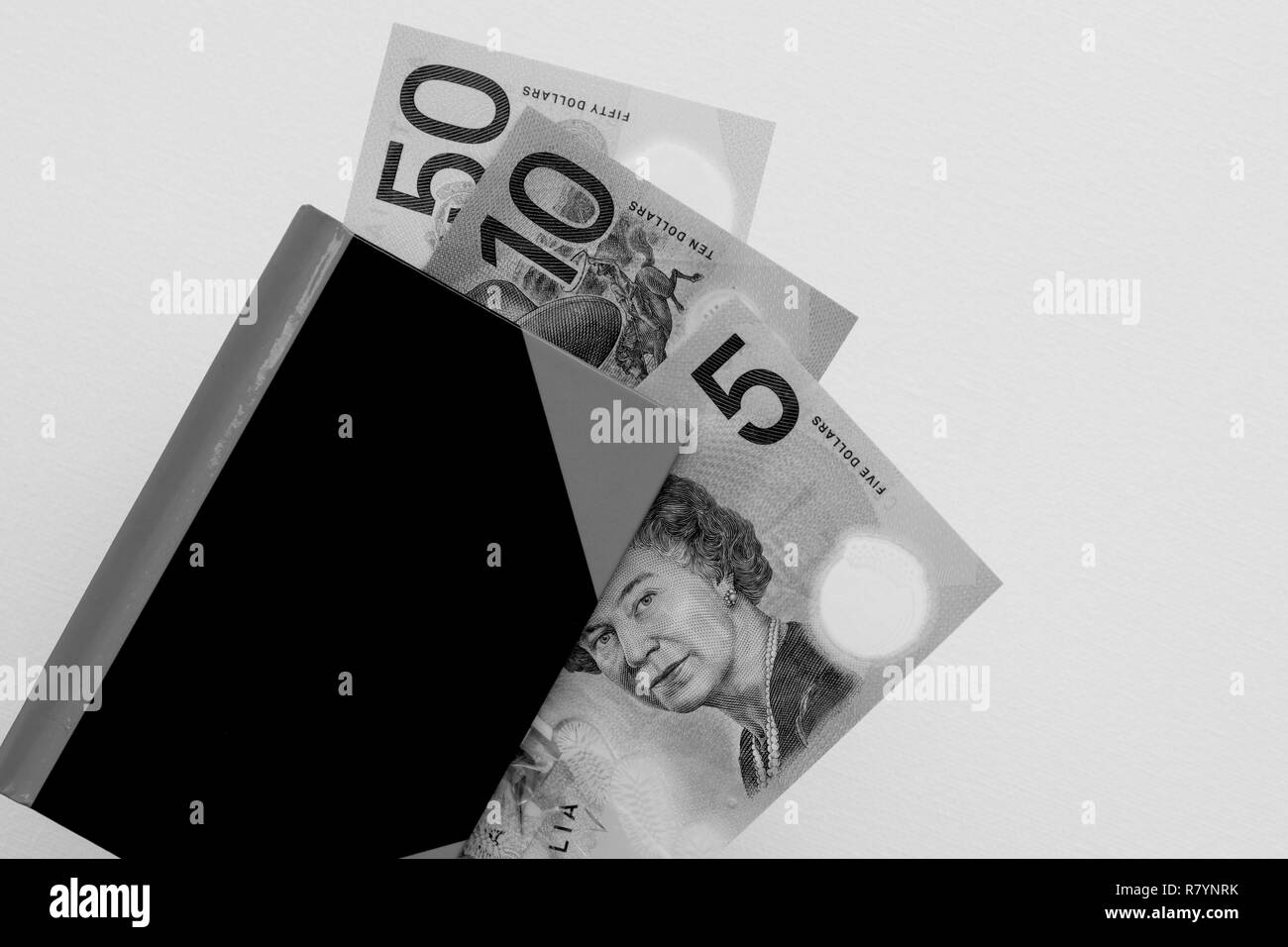 Dollaro australiano note in un notebook in bianco e nero. Foto Stock