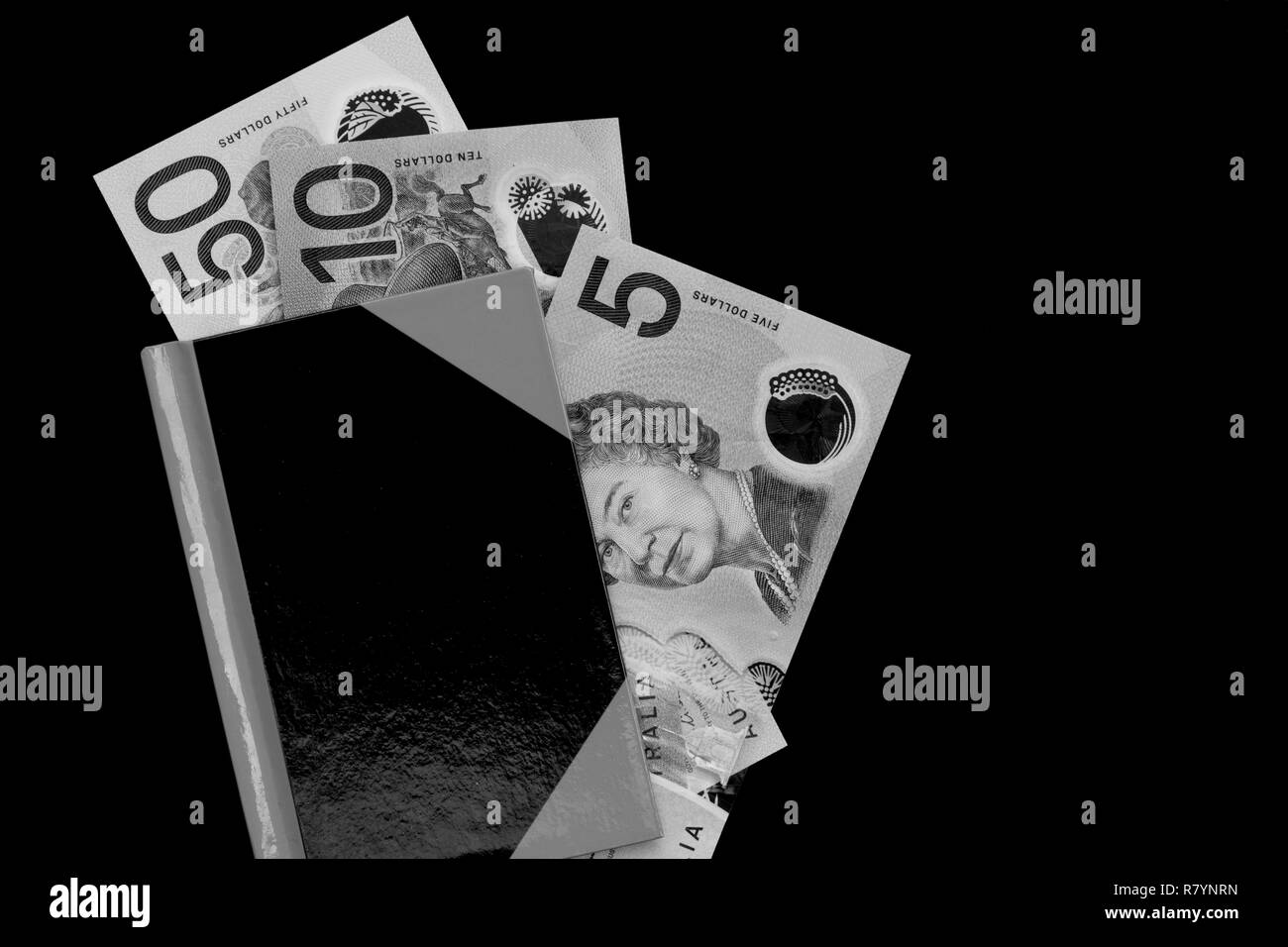 Dollaro australiano note in un notebook in bianco e nero. Foto Stock