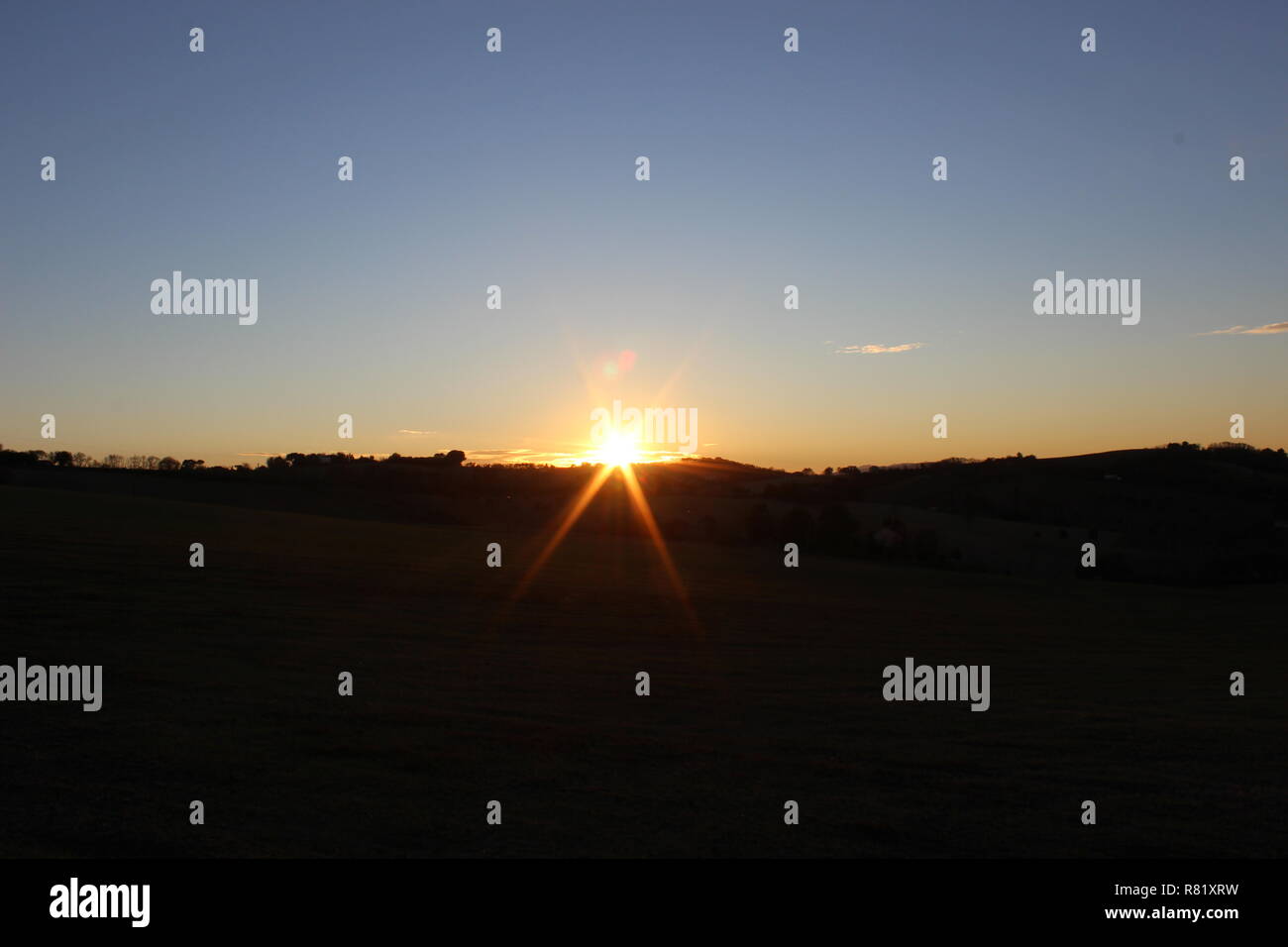 Il sole al tramonto Foto Stock