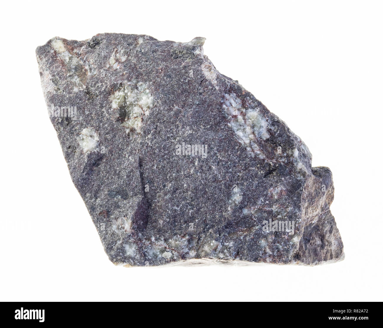 La fotografia macro di naturale minerale da collezione geologica - materie porphyritic basalto pietra su sfondo bianco Foto Stock