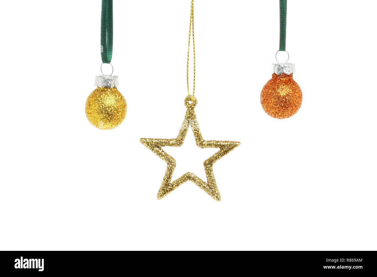 Oro glitter stella di Natale in miniatura e baubles isolata contro bianco Foto Stock