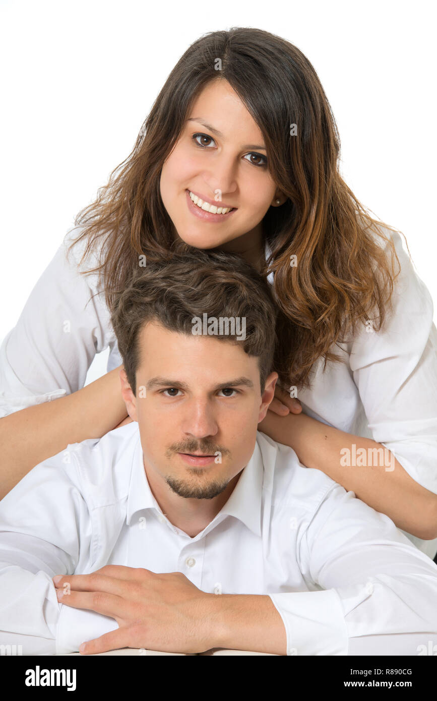 Felice coppia giovane isolato su bianco Foto Stock
