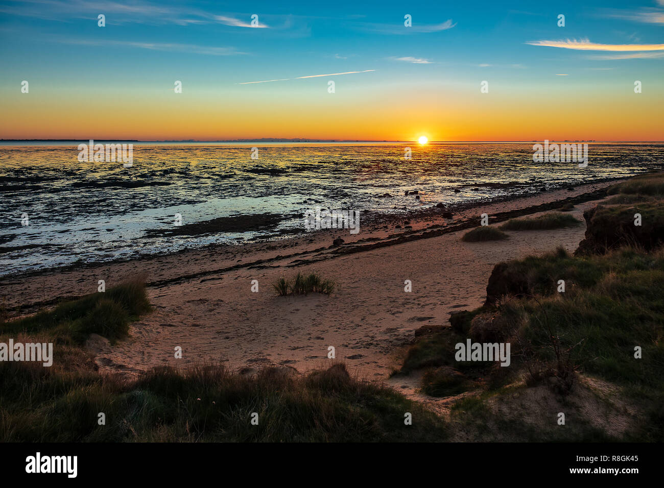 Alba sulla costa del Mare del Nord dell'isola Amrum, Germania. Foto Stock