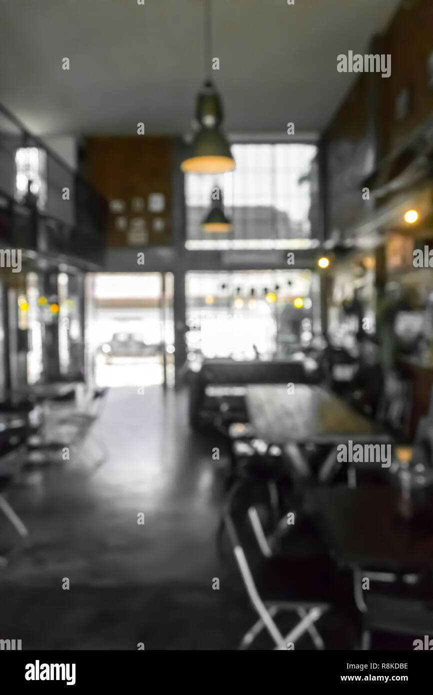 Cafe la sfocatura dello sfondo bokeh di fondo con luce. Ristorante abstract blur. Foto Stock