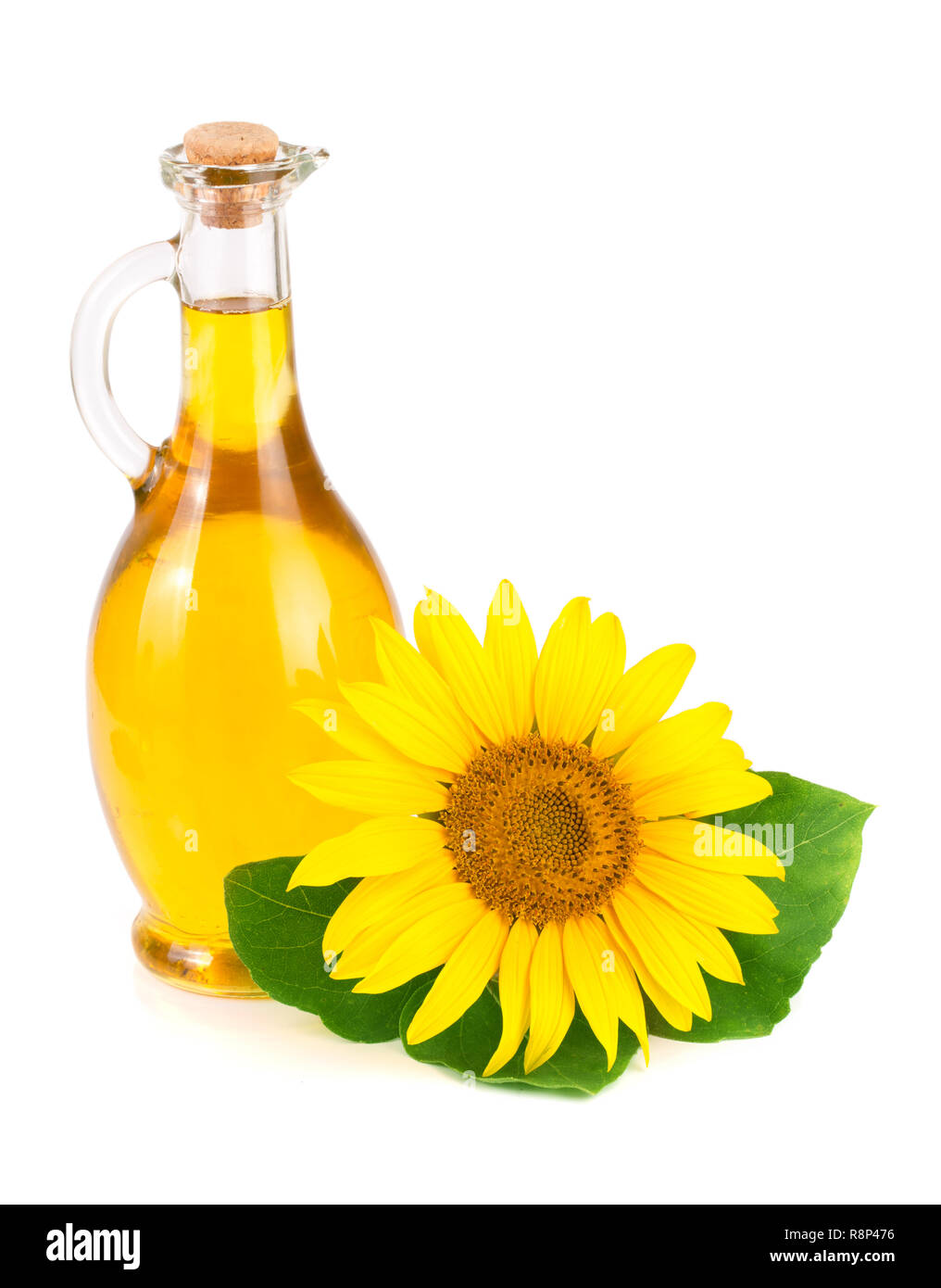 Olio di semi di girasole e fiore isolato su sfondo bianco Foto Stock