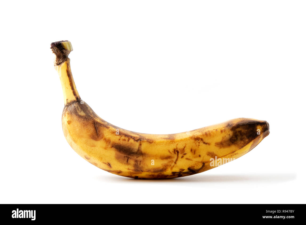 Marciume tutta la banana su sfondo bianco Foto Stock