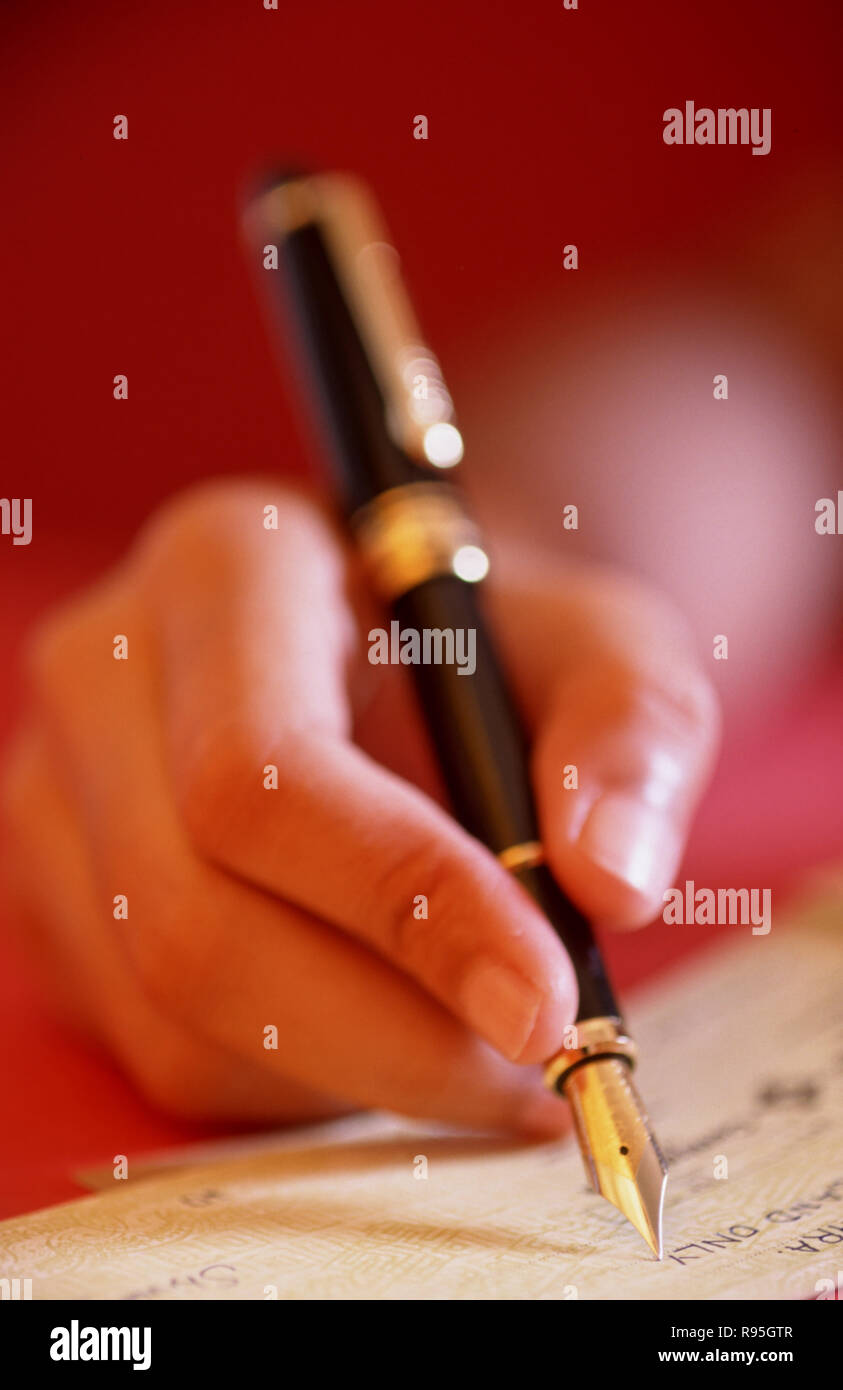 Scrivere con la penna stilografica Foto Stock