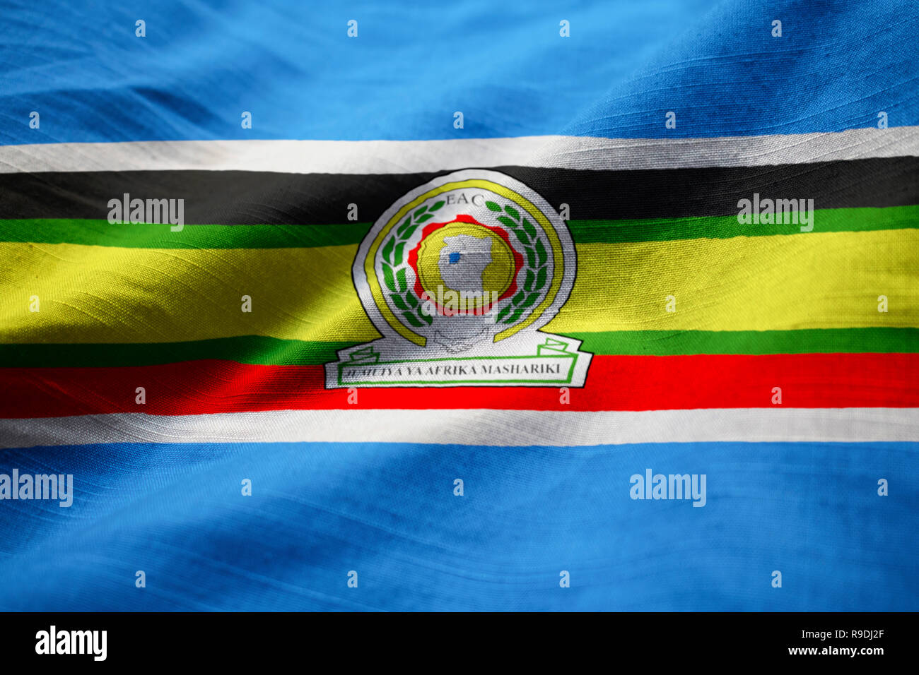 Primo piano della increspato East African bandiera comunitaria, East African bandiera comunitaria soffiando nel vento Foto Stock
