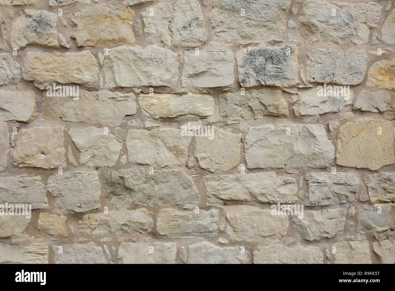 Tan muro di pietra texture. Foto Stock