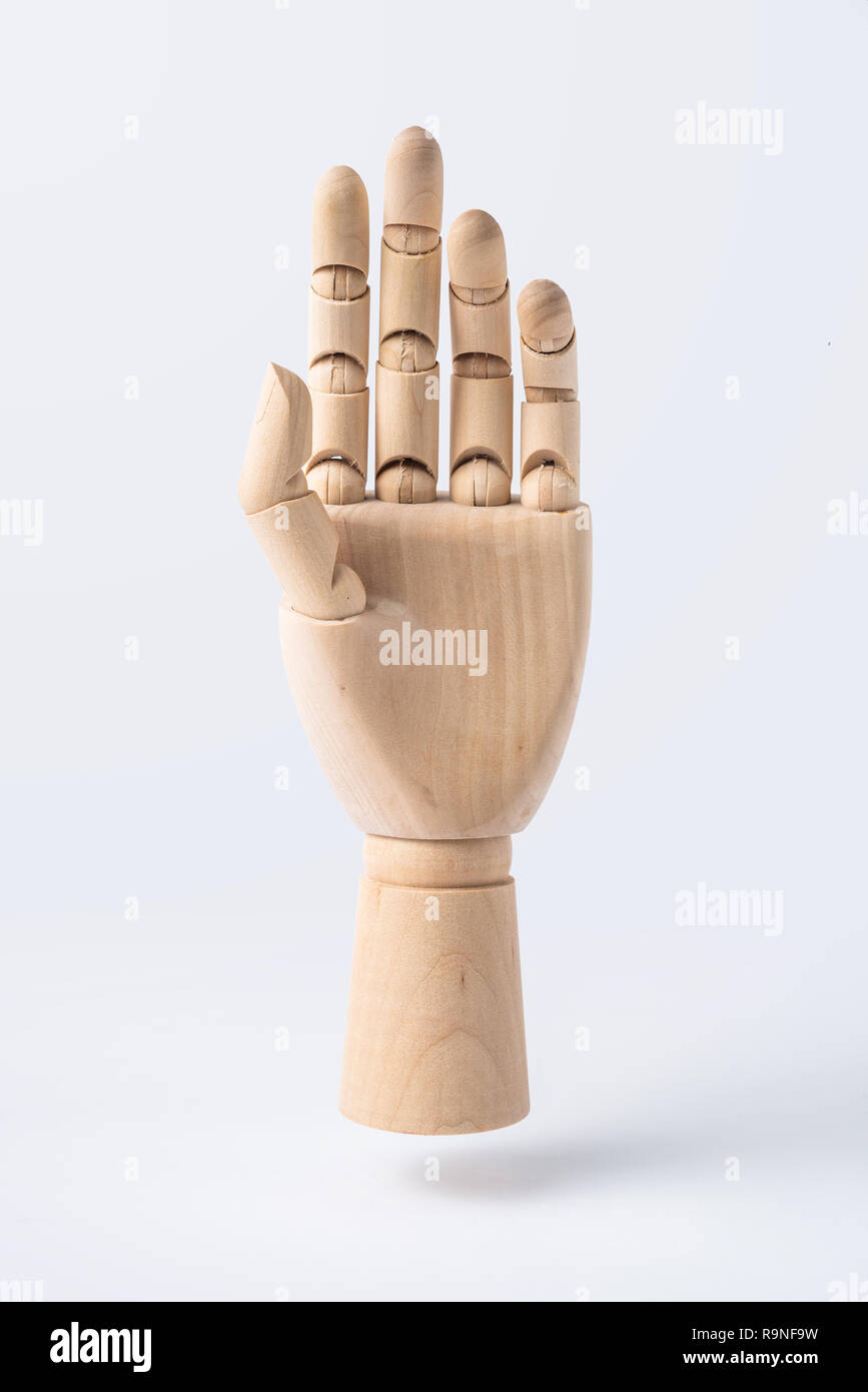 Business e design concept - legno di alzare la mano con gesto isolato su sfondo bianco Foto Stock