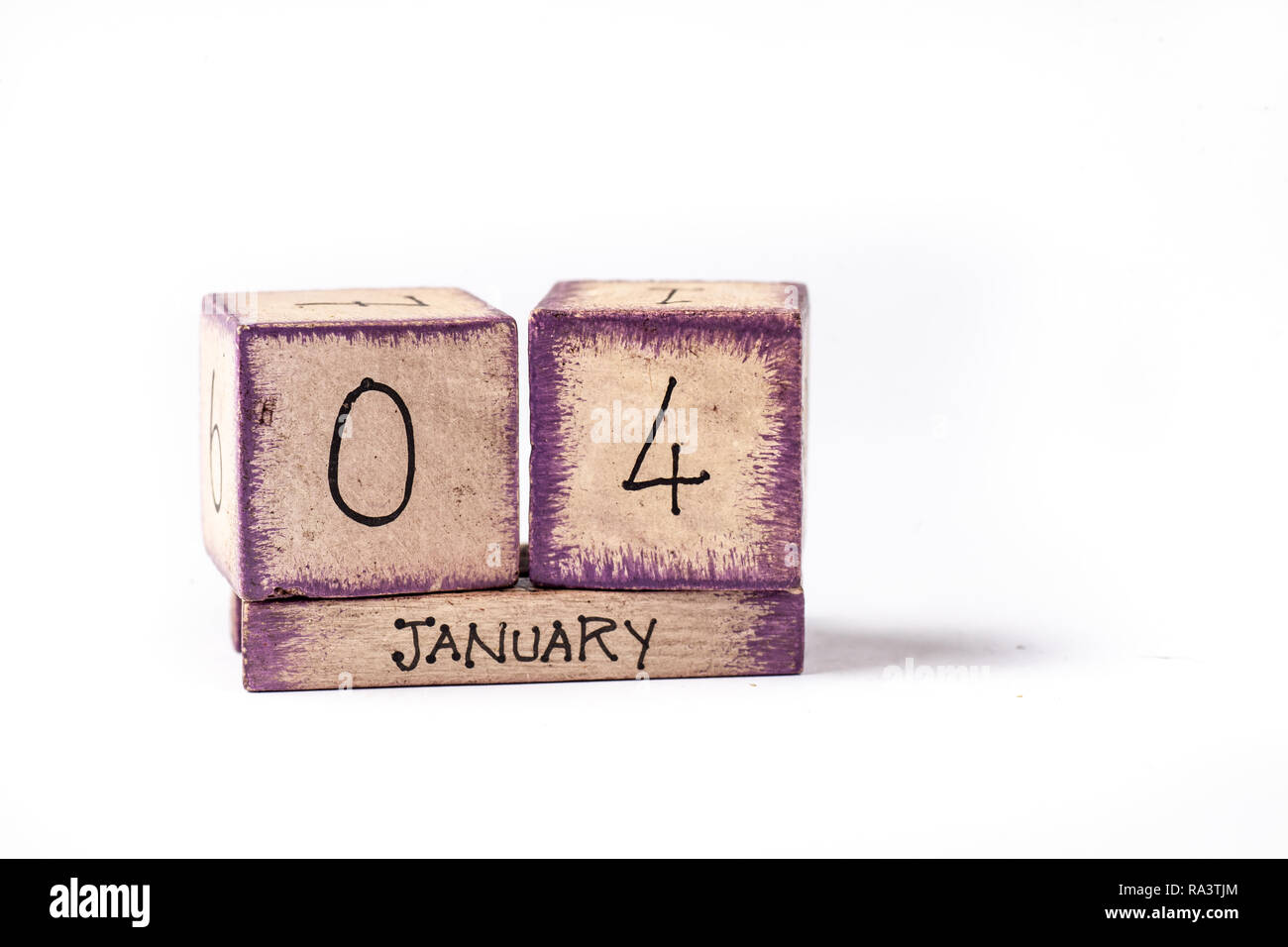 In legno colorato blocco calendario perpetuo che mostra 4 Gennaio Foto Stock