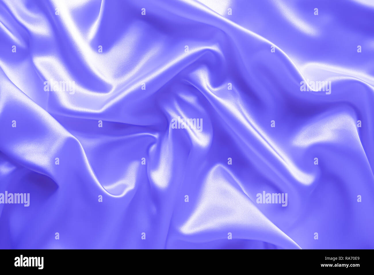 Liscia elegante blu ondulata di seta o di lusso in raso tessuto di consistenza, abstract background design. Foto Stock