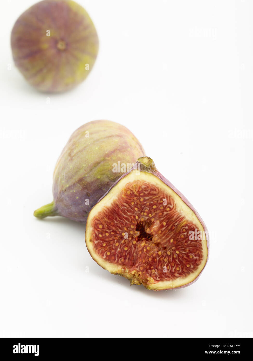 Sweet Fichi still-life cibo fotografia contro uno sfondo chiaro Foto Stock