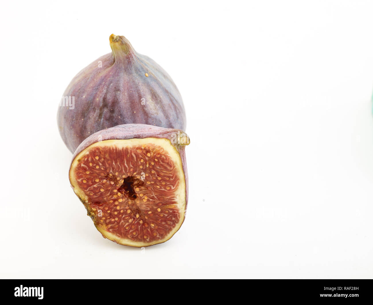 Fig frutto contro uno sfondo bianco, cibo still-life fotografia Foto Stock