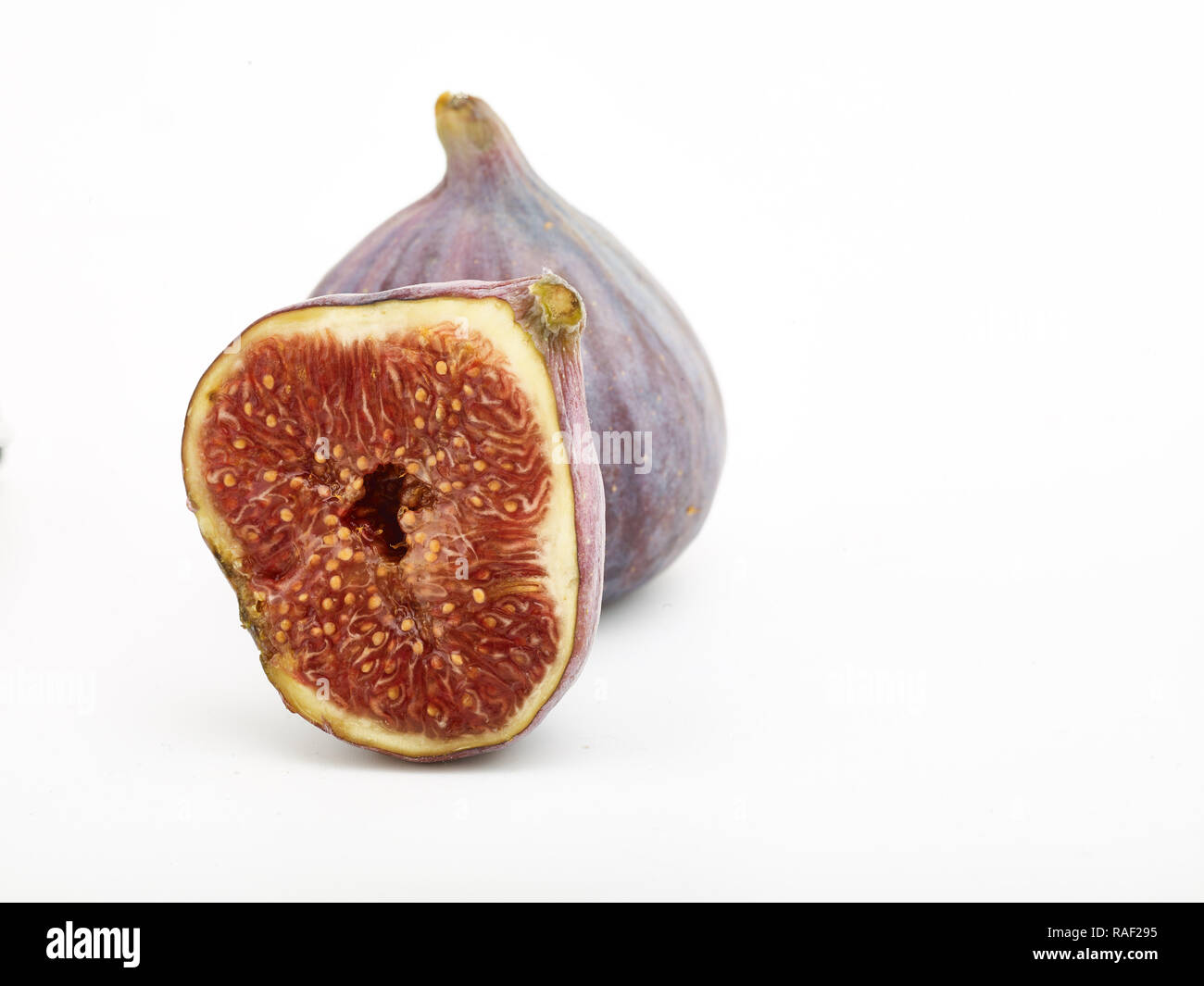 Fig frutto contro uno sfondo bianco, cibo still-life fotografia Foto Stock