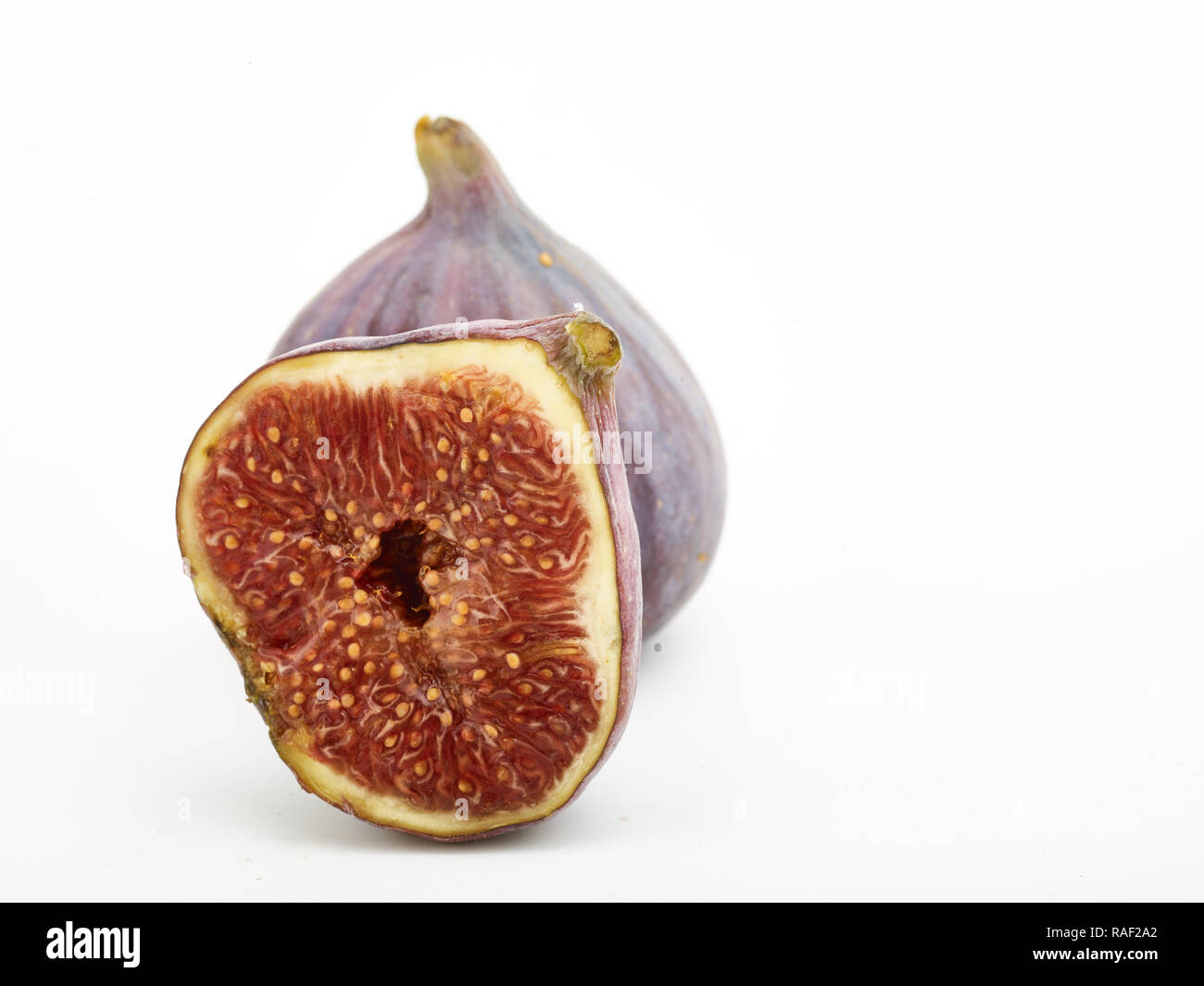 Fig frutto contro uno sfondo bianco, cibo still-life fotografia Foto Stock