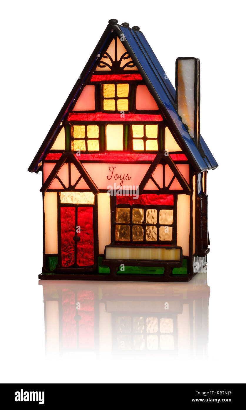 Un vetro illuminato negozio di giocattoli decorazione di Natale Foto Stock