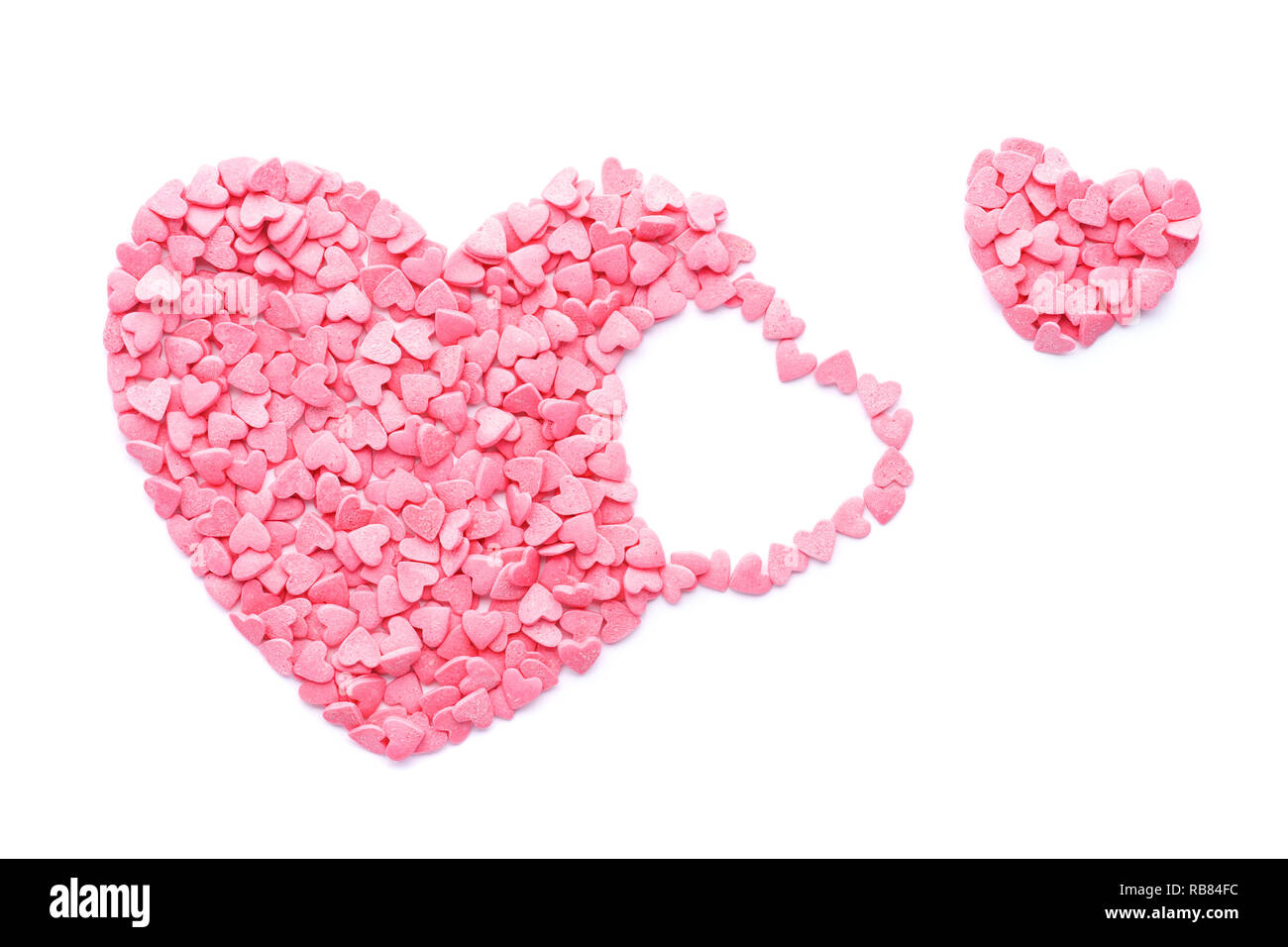Rosa Candy cuore volare fuori. Il giorno di San Valentino del concetto. Isolato. Foto Stock