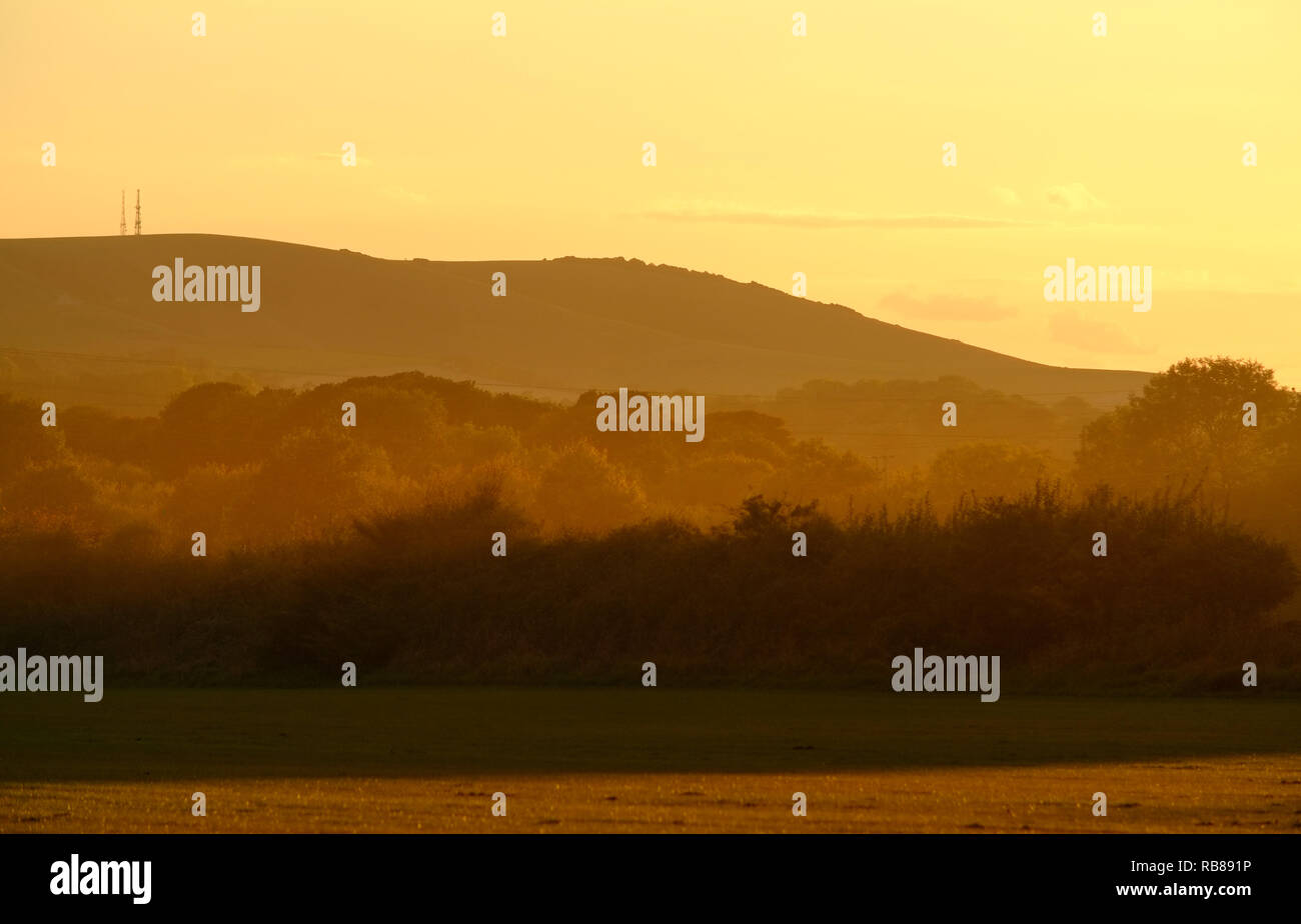 Sunset over Firle Beacon in South Downs National Park, Firle, East Sussex. Foto Stock