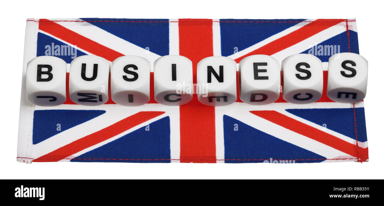 La parola Business sillabato su una bandiera dell'Union Jack Foto Stock