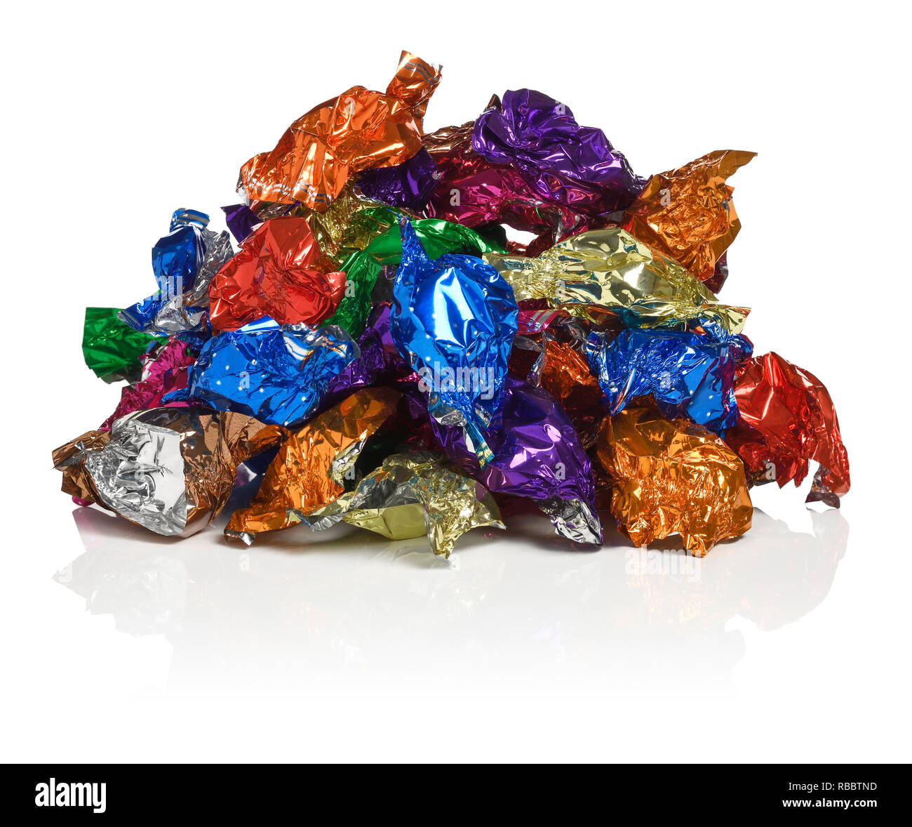 Una pila di carta stagnola wrapper dolce Foto Stock