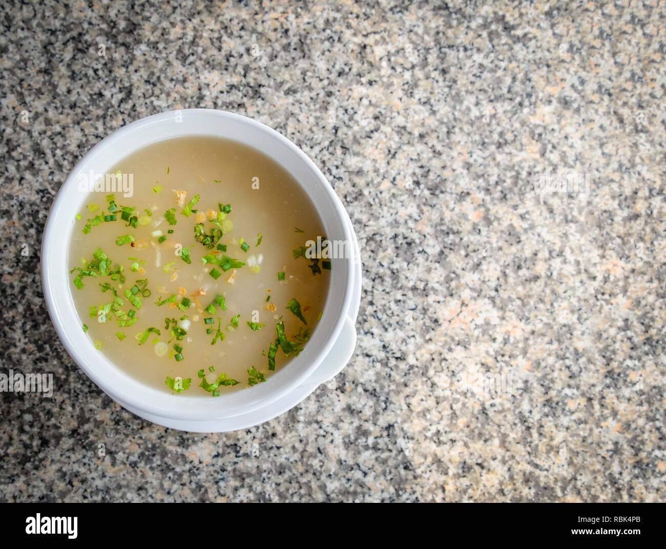 Mush morning breakfast on table mush with soup best food in white bowl made from thai rice to boil on granite texture background - traditional Chinese Foto Stock