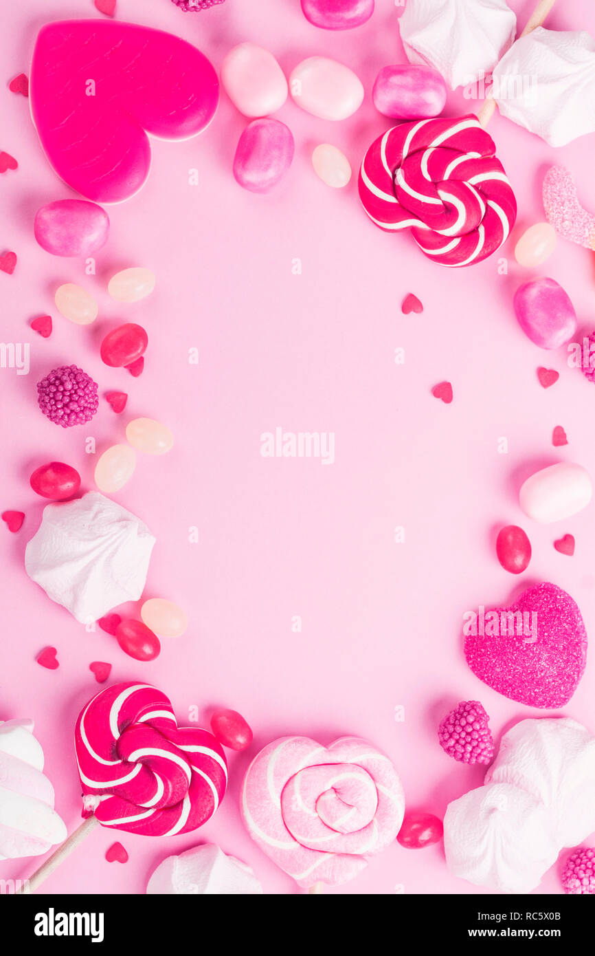 Caramelle, lecca-lecca, jelly in rosa Foto Stock