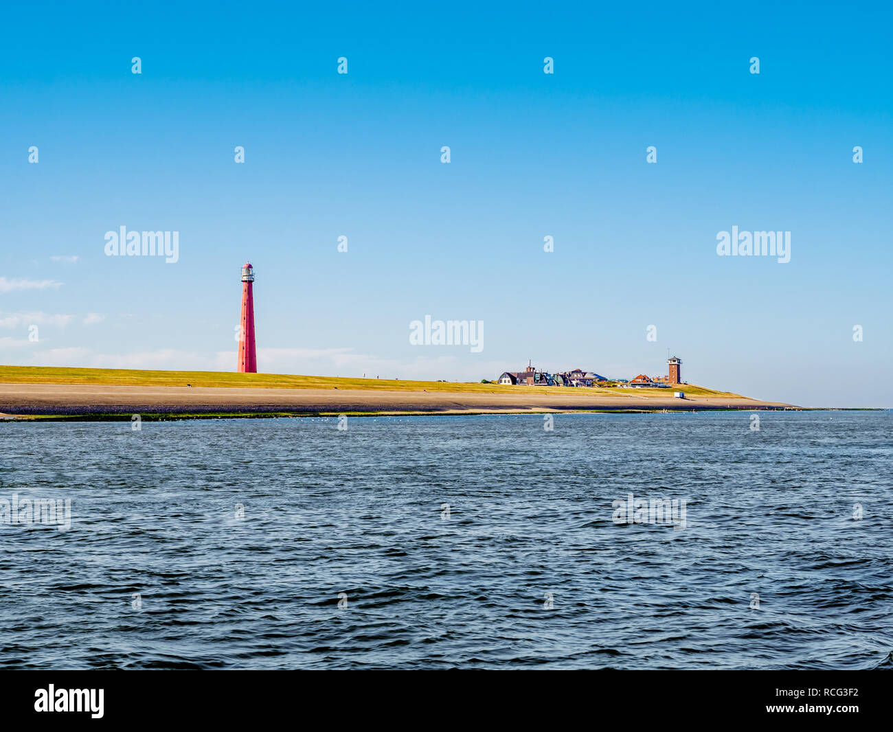 Faro Lange Jaap alla costa del Mare del Nord di Huisduinen vicino a Den Helder, Paesi Bassi Foto Stock