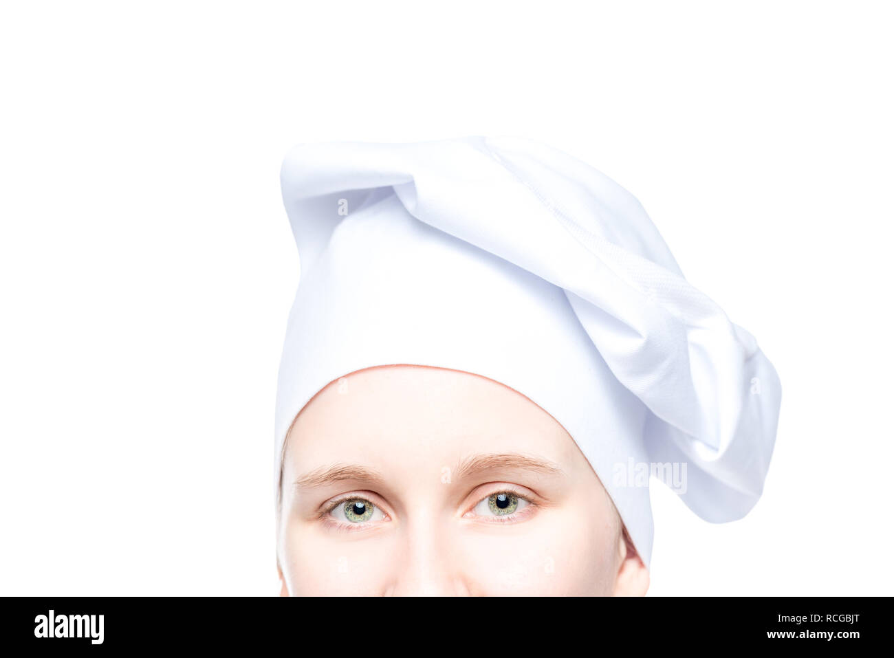 Lo chef femmina agli occhi con hat close up su sfondo bianco Foto Stock