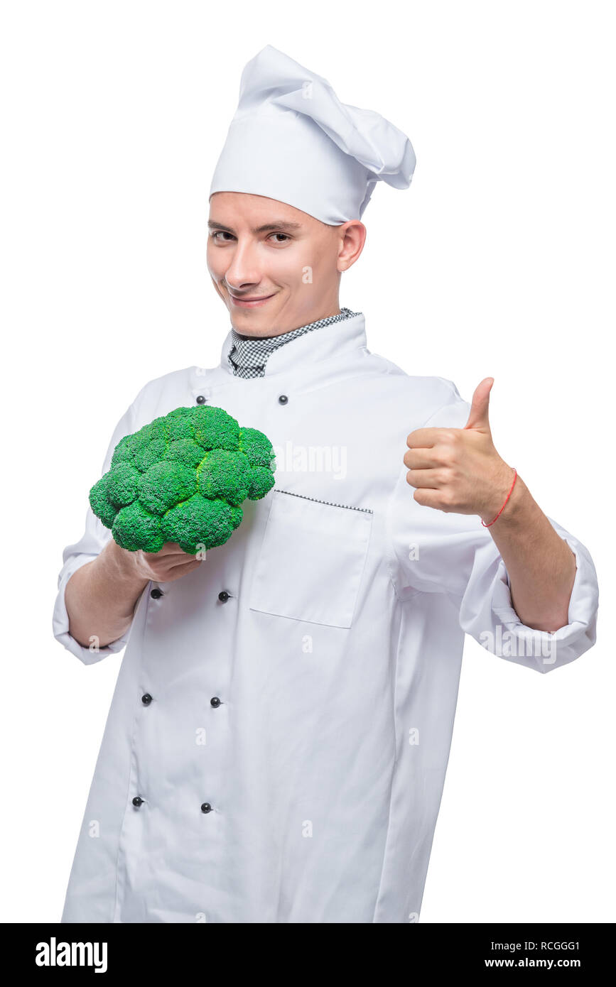 Master culinario con broccoli su sfondo bianco in posa Foto Stock