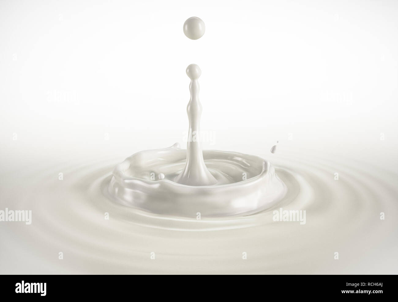 Una singola goccia di latte di spruzzi di latte in piscina con increspature. Su sfondo bianco. Percorso di clipping incluso. Foto Stock