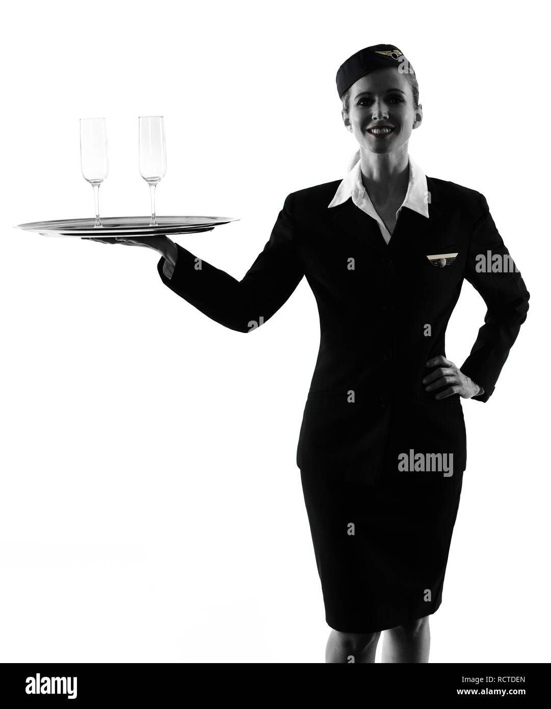 Una hostess caucasica equipaggio di cabina donna isolato su sfondo bianco in silhouette Foto Stock