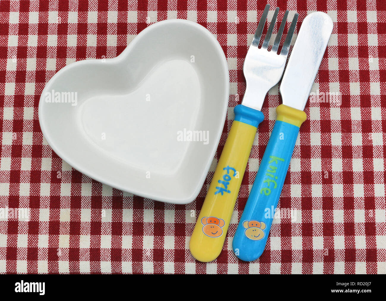 A forma di cuore e ciotola Bambinos' posate Foto Stock