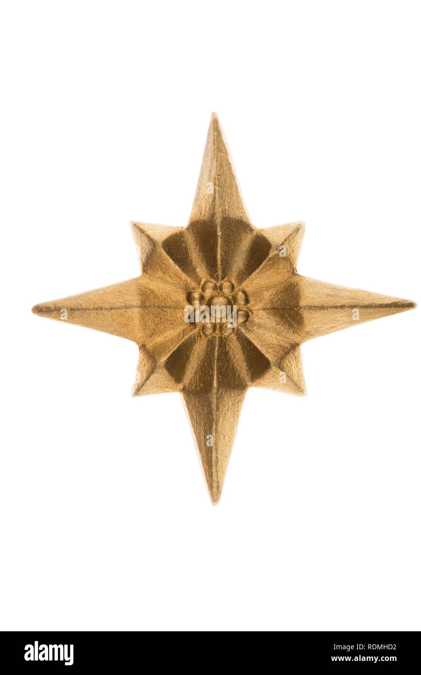 Stucco dorato asterisco. Isolato su sfondo bianco Foto Stock