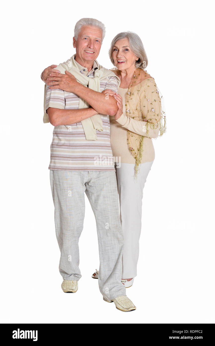 Ritratto di coppia senior avvolgente su sfondo bianco, a piena lunghezza Foto Stock