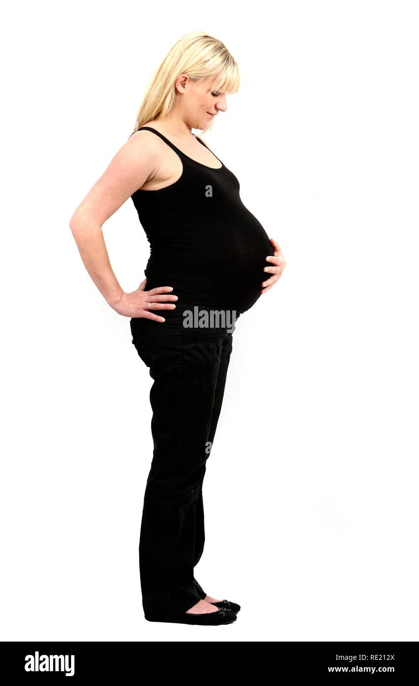 Donna incinta, 9 mese Foto Stock