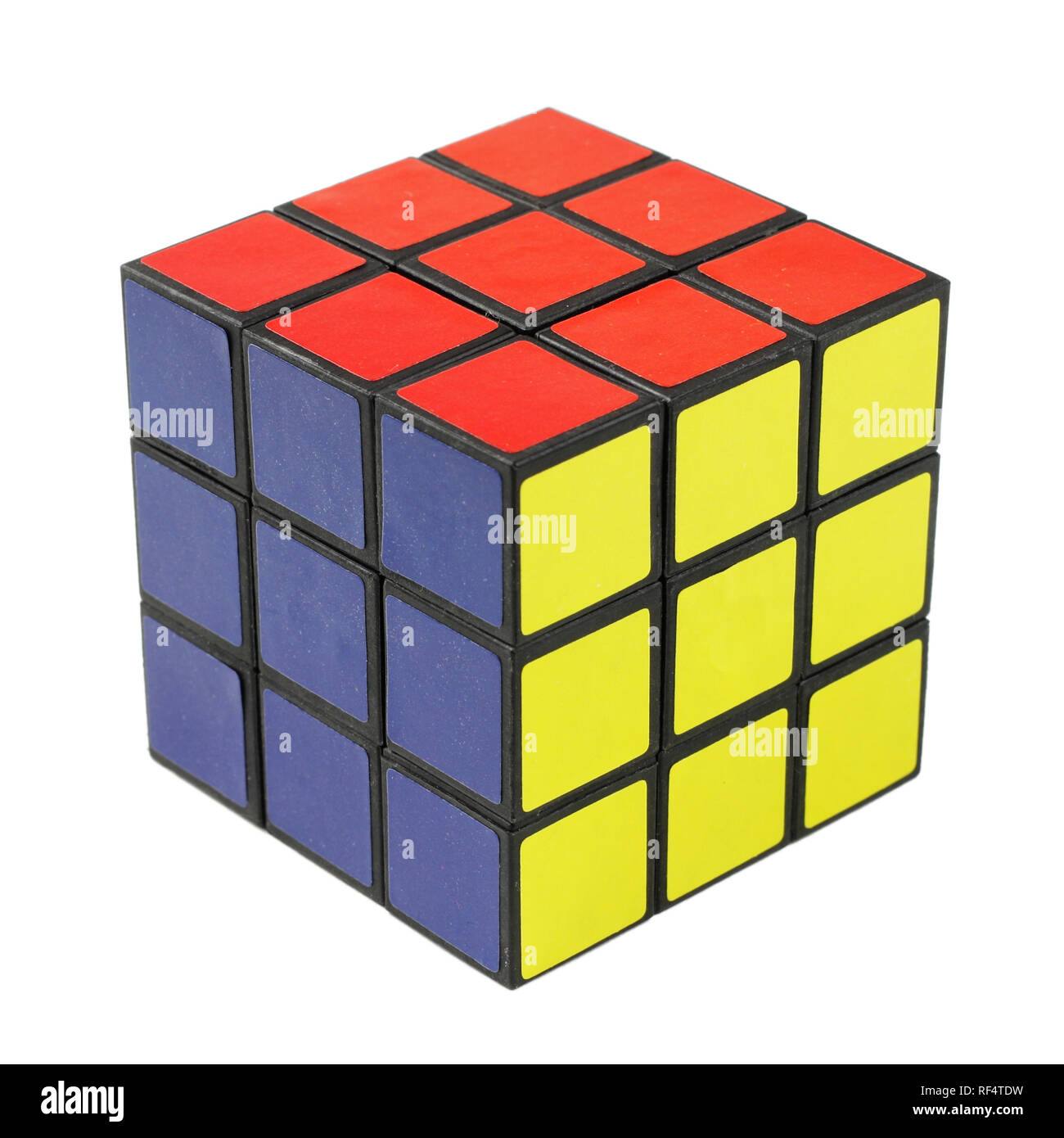 Completato il cubo di Rubik isolato su bianco Foto Stock