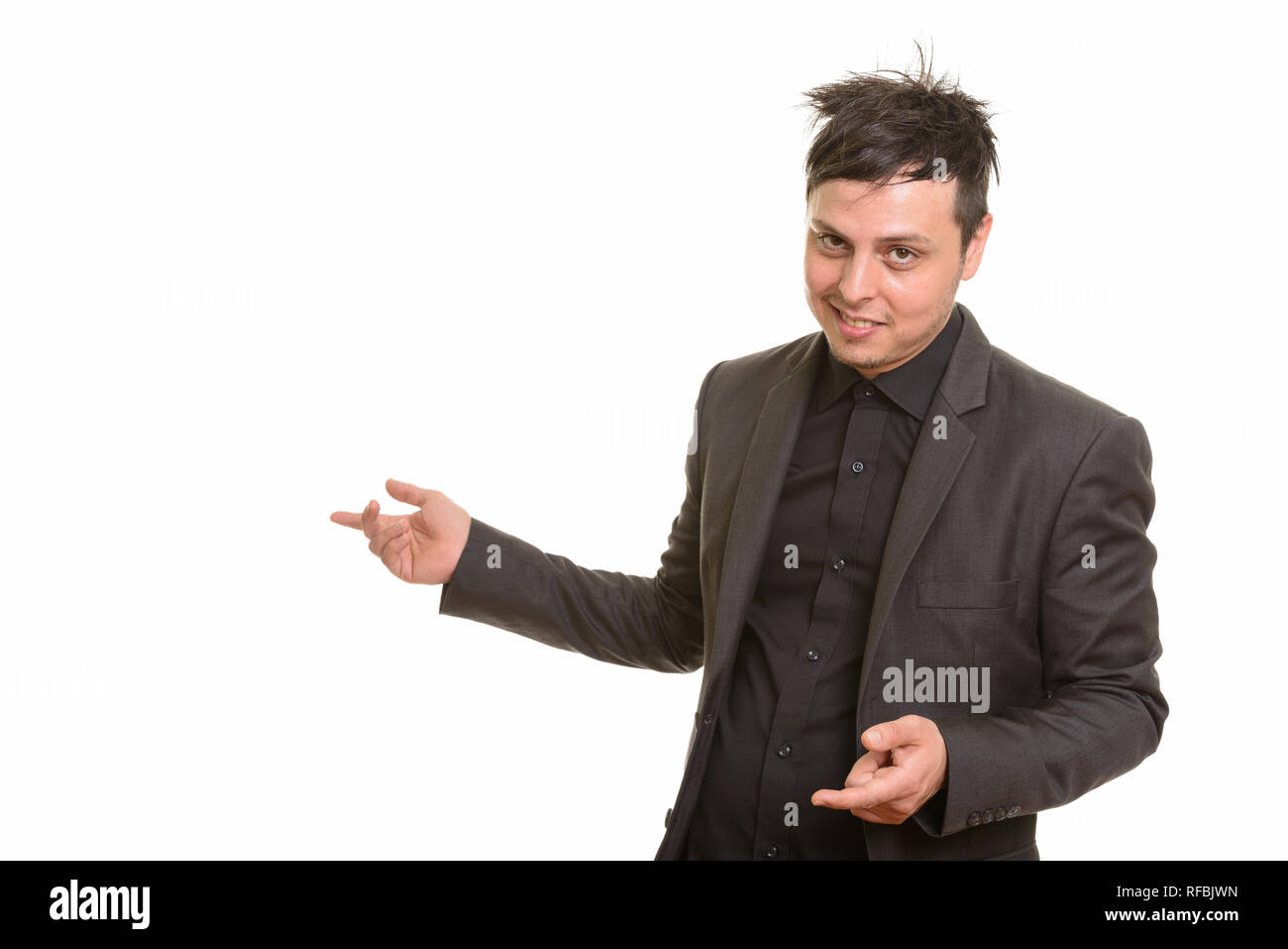 Studio shot di crazy imprenditore caucasico mostrando qualcosa di Foto Stock