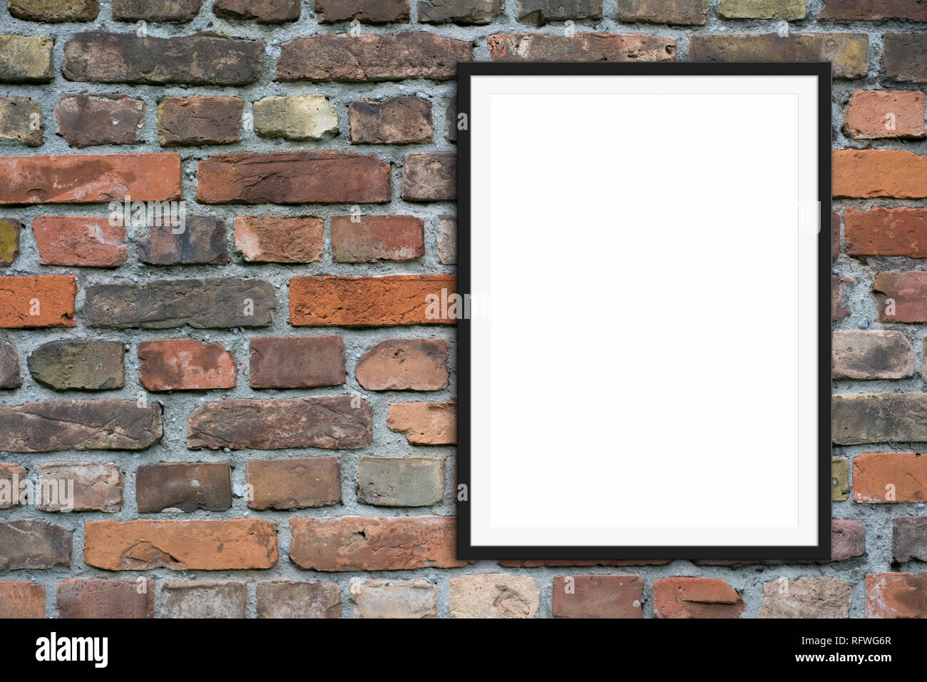 Empty picture frame mock-up e spazio copia onbrick muro di pietra sullo sfondo Foto Stock