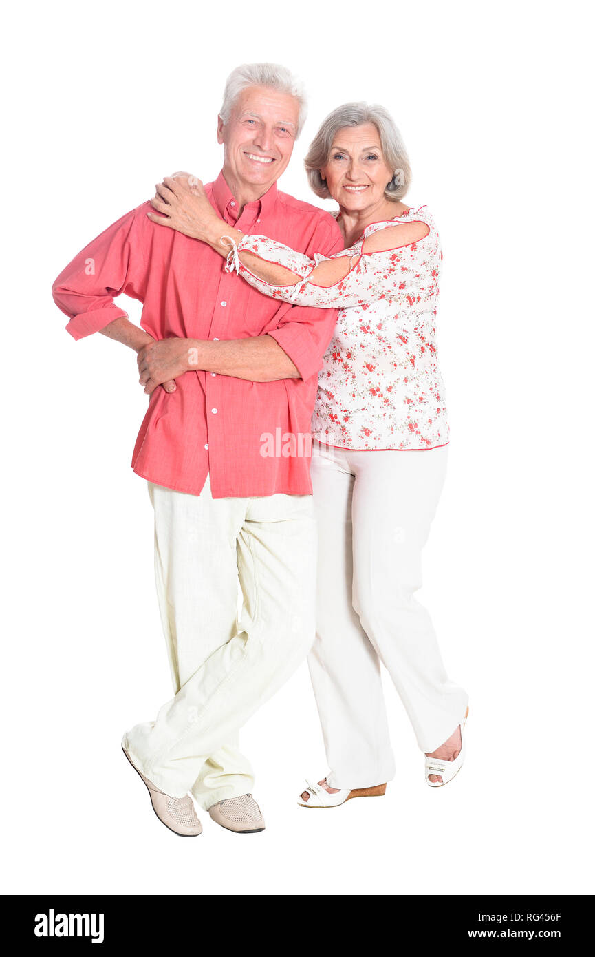 Felice coppia senior in posa su sfondo bianco Foto Stock