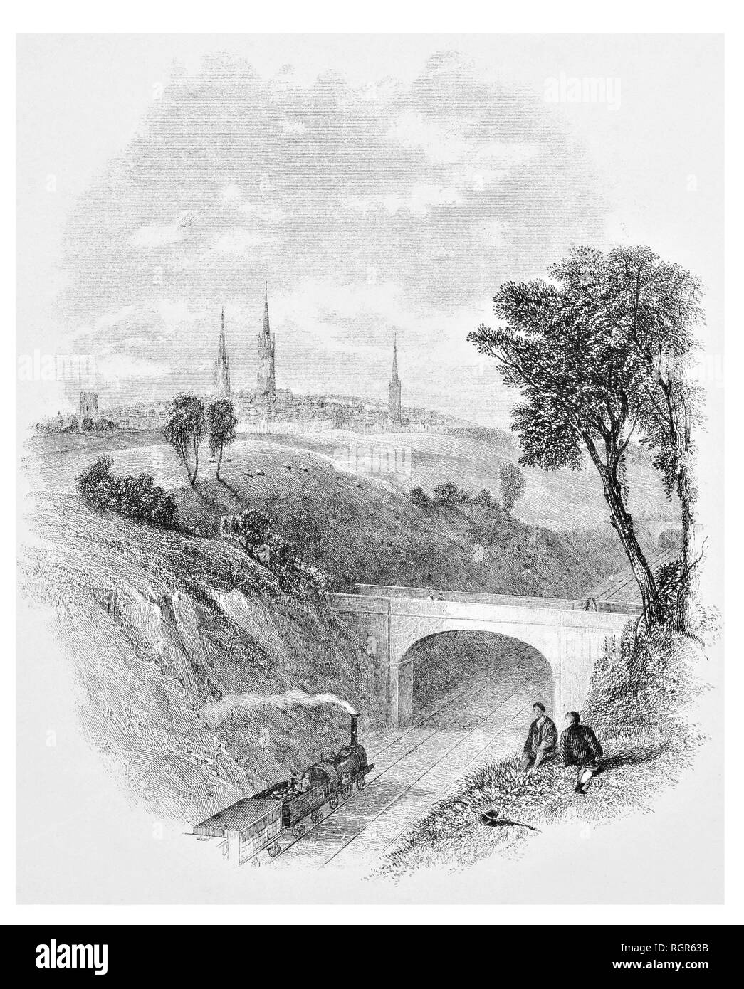 Gli uomini a guardare il treno a vapore sotto il ponte a Coventry Foto Stock