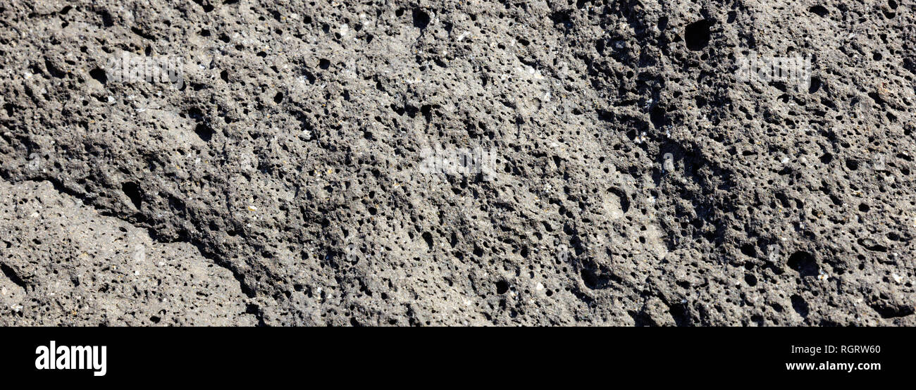 Naturale di pietra lavica texture di sfondo grigio scuro, colore nero, banner, dettaglio Foto Stock