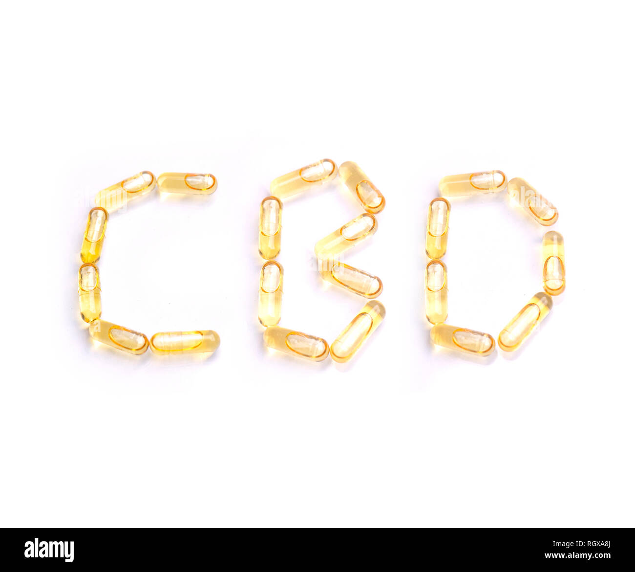 Macro dettaglio di canapa pillole con olio di CBD isolate su sfondo bianco - La marijuana medica nozione Foto Stock