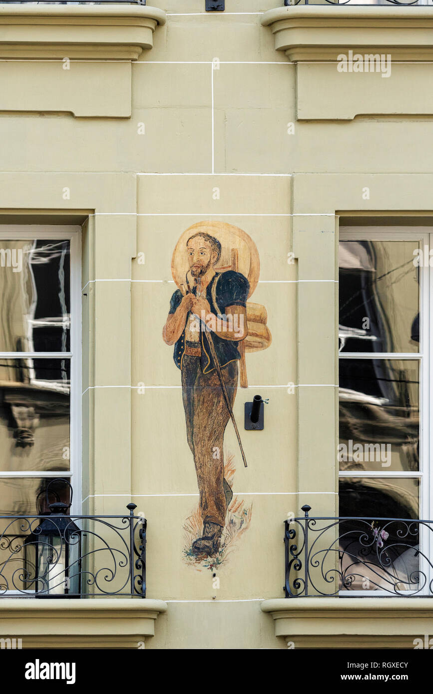 La pittura di un formaggio maker su una parete della città vecchia di Berna, Svizzera Foto Stock