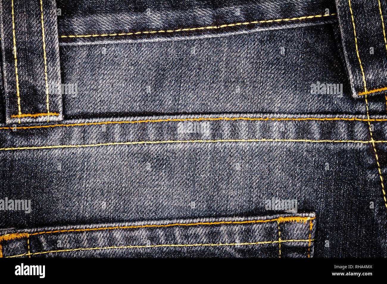 Indossato il nero jeans denim texture con punti di cucitura. Abstract jeans sfondo texture Foto Stock