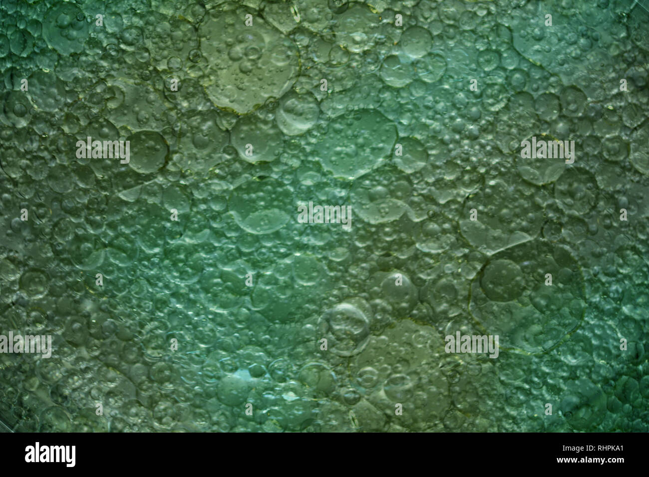 Divertiti con la fotografia macro di olio e acqua Foto Stock